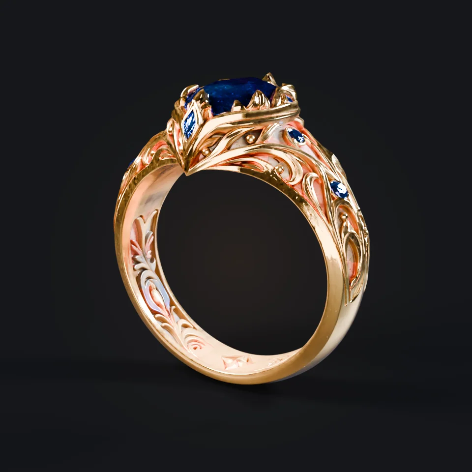 Turntable study: the gold ring with a deep-blue gemstone on a dark stage.